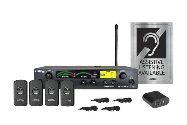 Composite image of an RF transmitter, one antenna, four receivers, four earbuds, one 4-port USB charger, and signage.