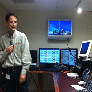 Man using microphone with computer system