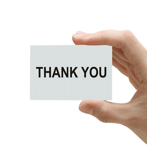 Hand with Thank You written on card