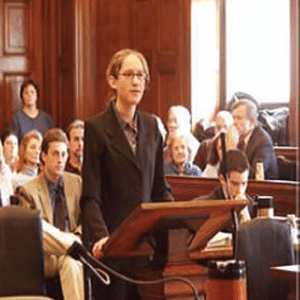 Professional business woman standing at a pulpit