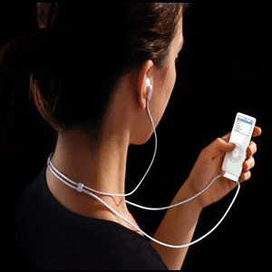 Woman listening to music on iPod Touch through earbuds