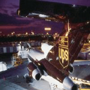 UPS branded airplane at an airport at dusk