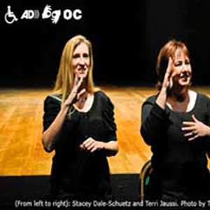 Women doing sign language to audience