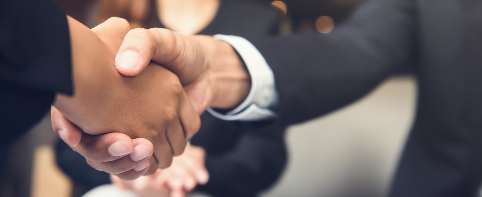 Two hands shaking after a business meeting