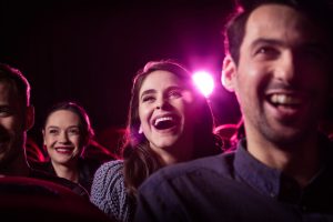 Young people watching a comedy show