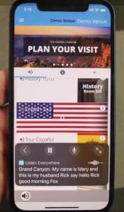 Close up photo of a demo screen in Listen Everywhere on a smartphone that shows live captioning at the bottom of the screen. The captioning 